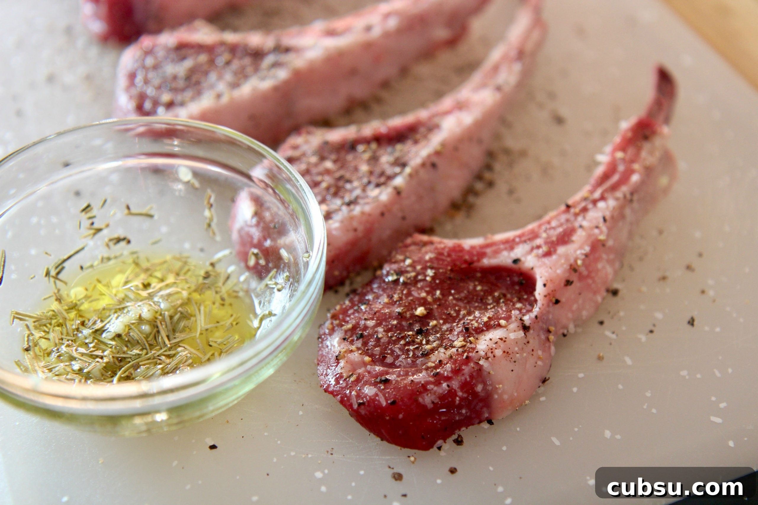 lamb chops, garlic, rosemary, salt, and pepper. 