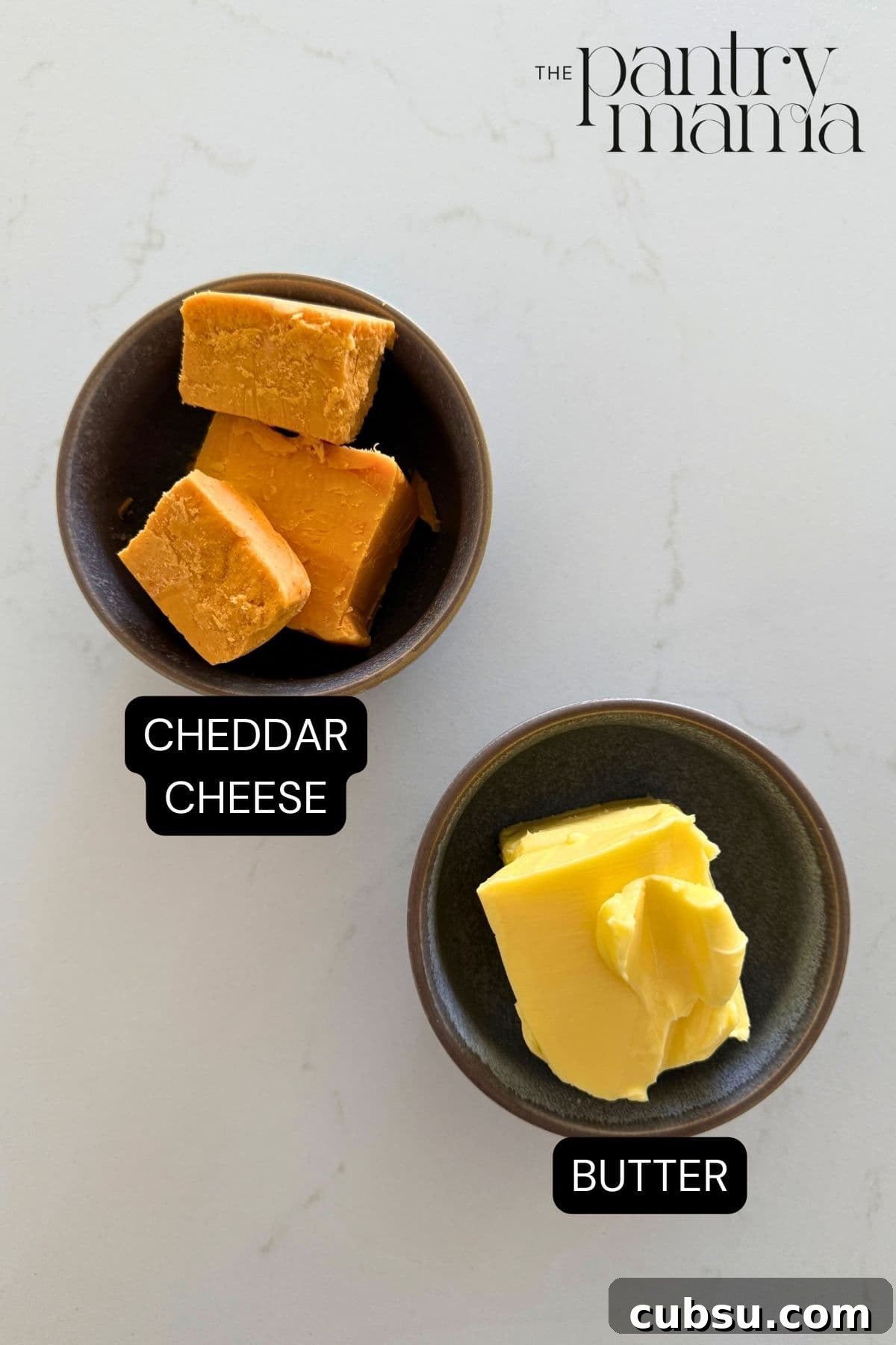 Labeled ingredients on the counter to make cheddar butter.