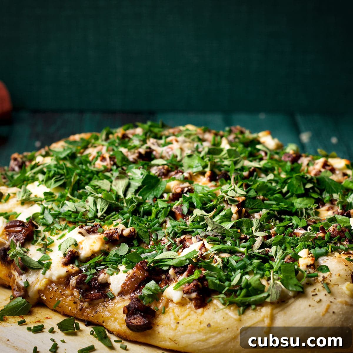 A freshly baked mushroom pizza made with homemade pizza dough.