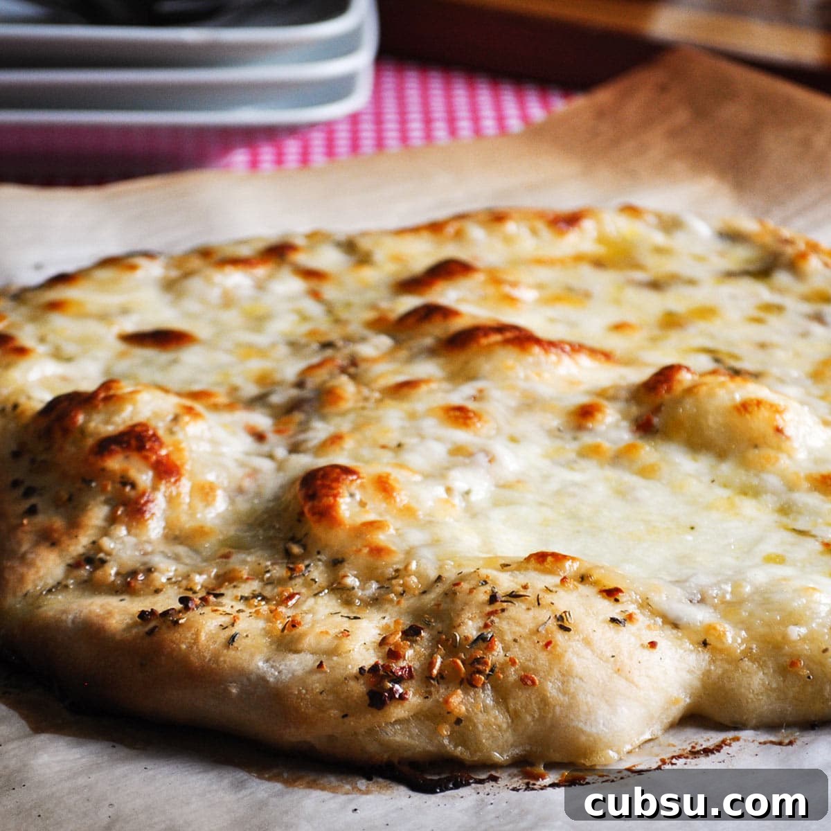 A just baked homemade cheese pizza.