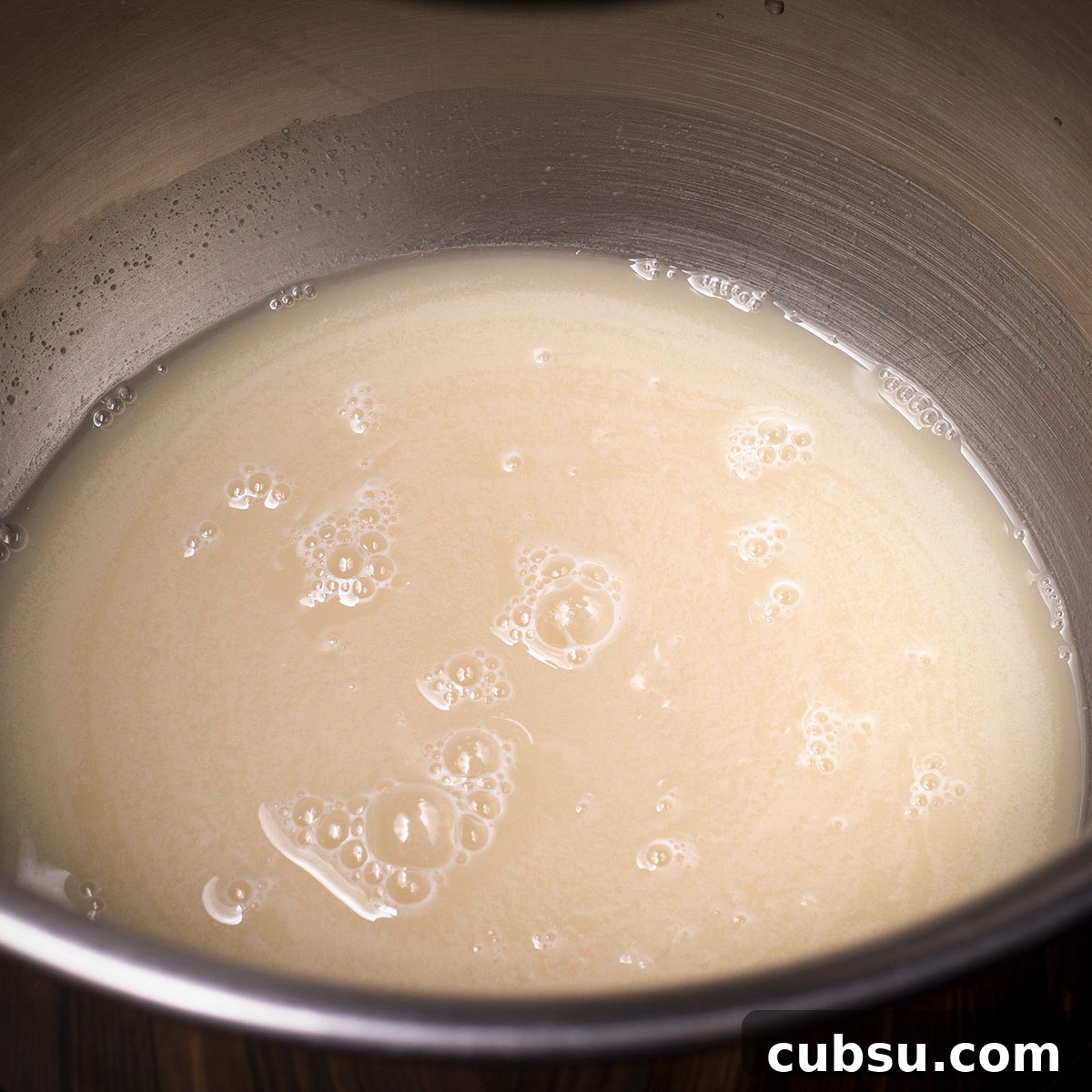 Yeast in a bowl of warm water that's just started to bubble and make the water creamy.
