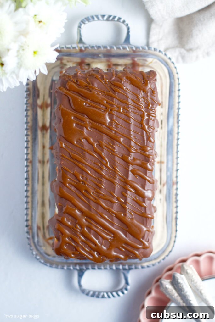 caramel drizzle over chocolate ganache on top of a cake