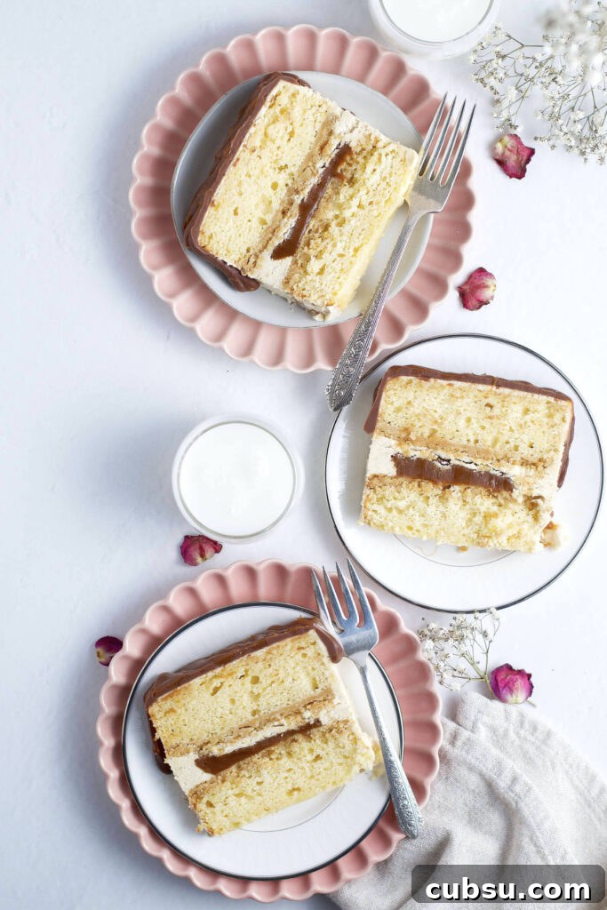 three plates holding slices of ultimate Twix cake