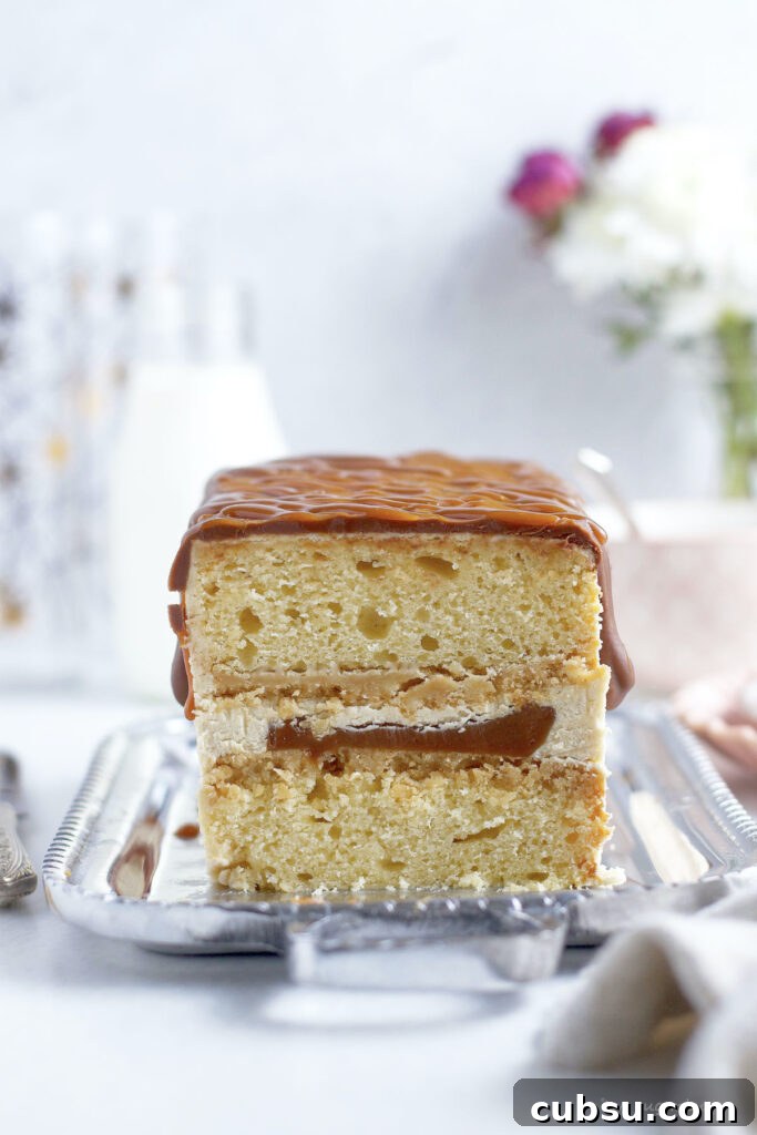 ultimate Twix cake showing inside layers on a serving platter